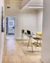 Hallway with area for desk or dining leading to bathroom at Model Tobacco Lofts.