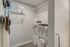 Bright and spacious walk-in closet with elegant wire shelving, complementing decor, and stylish organization baskets.