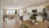Modern open-concept kitchen and living room with sleek design, natural light, and elegant furnishings.