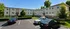 Charming three-story apartment complex with lush greenery, ample parking, and a serene suburban setting.