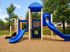 Vibrant playground featuring blue slides and climbing structures nestled in lush greenery, ideal for family-friendly living.