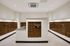 Elegant mailroom with sleek bronze mailboxes, offering a spacious and modern design for convenience and efficiency.