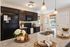 Elegant kitchen with dark wood cabinets, granite countertops, and modern appliances. Bright and welcoming dining area perfect for gatherings.