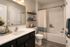 Elegant modern bathroom with sleek fixtures, soft lighting, and stylish decor featuring a white vanity, spacious mirror, and cozy bath setting.
