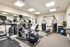 Modern fitness center featuring state-of-the-art gym equipment, bright lighting, and motivational decor.