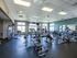 Exercise equipment in community fitness center at The Landings at Chandler Crossings | Student Housing Near Michigan State University