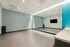 Contemporary exercise room with stylish patterned wall, full-length mirror, and chic design.