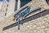 Modern apartment building facade at Topaz, featuring stylish stonework and eye-catching architecture.