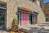 Inviting modern storefront with elegant stone facade featuring Dunkin' and Jimmy John's, promising a vibrant community destination.