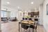 Modern open-concept apartment with stylish kitchen, cozy living room, and elegant dining area. Bright space with sleek furniture and contemporary decor.
