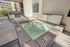 Elegant rooftop hot tub with modern design and cityscape views, inviting relaxation in a serene setting.
