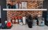 Elegant coffee station with a Keurig machine, assortment of coffee pods, and stylish copper backsplash.