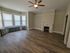 311 south 41st street bedroom with hardwood flooring, fireplace mantel, and closet.
