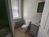 311 south 41st street bathroom with toilet, sink, vanity, and medicine cabinet.