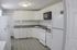 4036 sansom street apartment kitchen area with stove/oven, dishwasher, microwave, and refrigerator. philadelphia university city
