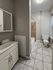 4036 locust street house bathroom with tile flooring, toilet, shower/tub, sink vanity, and medicine cabinet. philadelphia university city