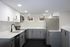 4029 walnut street unit 19 renovated philadelphia university city.  renovated kitchen with white granite countertops, white and grey cabinets, and stainless steel appliances; dishwasher, stove/oven, microwave, and refrigerator.