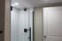 4029 walnut street unit 19 renovated philadelphia university city.  renovated white tiled standing shower with black finishes.