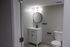 4029 walnut street unit 19 renovated philadelphia university city. bathroom with sink vanity, mirror, and toilet.