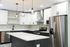 204 south 41st street renovated kitchen area with hardwood floors, stainless steel appliances, granite countertops and white cabinets.