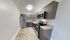 4111 walnut street philadelphia kitchen with stainless steel refrigerator, stove, and microwave