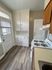 4418 spruce philadelphia kitchen with white appliances and built in cabinetry