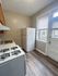 4418 spruce philadelphia kitchen with white appliances and backdoor