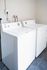 Pristine laundry area featuring modern washer and dryer set, offering convenience and efficiency in your home.