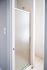 Elegant frosted glass shower door in a bright, modern bathroom with tile flooring.