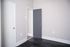 Chic apartment entryway with sleek dark flooring and modern door design, exemplifying contemporary elegance.