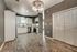 Modern kitchen with sleek cabinets, stainless steel appliances, and elegant lighting in a stylish open layout.