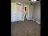 Cozy apartment room showcasing plush carpet, bright lighting, and modern white doors, perfect for personalized d&eacute;cor.