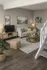 Cozy living room featuring a modern sofa, stylish coffee table, and natural decor accents in a bright, inviting space.