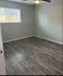 Cozy apartment room showcasing bright lighting, and modern white doors, perfect for personalized d&eacute;cor.