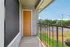 Charming balcony with vibrant views, featuring a modern finish and lush greenery, perfect for relaxing.