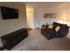 Long Pond Village Apartments, interior, living room, carpeted, natural light, leather lounge chair, tv