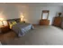 Long Pond Village Apartments, interior, carpeted, spacious bedroom, bed, nightstands, dressers, mirror, natural light