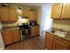 Long Pond Village Apartments, interior, wood flooring, stainless steel stove/oven, microwave, tan cabinets