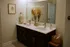 Timber Creek Phase 4 virtually staged bathroom featuring elegant double vanity with chic decor, modern fixtures, and soothing neutral tones.