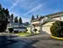 Beautiful suburban houses with landscaped driveways and lush greenery.