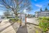 Welcoming view of Forest Park Apartments featuring lush greenery, ample parking, and convenient location.
