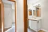 Bright and inviting bathroom with elegant vanity and modern lighting.
