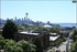 Captivating cityscape view showcasing Seattle's iconic skyline and Space Needle with lush greenery and vibrant urban life.