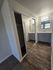 Elegant bathroom space featuring contemporary mirrored closets and sleek dual-sink vanity with stylish lighting.