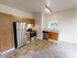 Updated kitchen with wood cabinetry at Terrace View apartments in First Hill, Seattle, WA