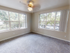 Bright bedroom with large windows at Terrace View apartments in First Hill, Seattle, WA