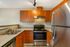 Open kitchen with stainless appliances in 2-bedroom apartment at Terrace View in First Hill, Seattle, WA