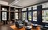 Clubhouse with pub style seating and kitchen at Campus Circle in Gainesville, Florida