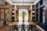 Clubhouse with pub style seating and kitchen at Campus Circle in Gainesville, Florida