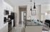 Spacious kitchens with white shaker cabinets, dark quartz counters, and pantries at Campus Circle in Gainesville, Florida